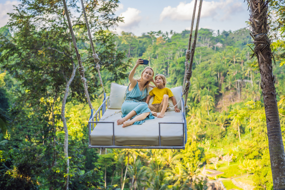 Mother,And,Son,Swinging,In,The,Jungle,Rainforest,Of,Bali